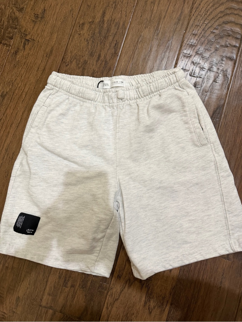 Zara Light Cream Athletic Shorts with Black Patch